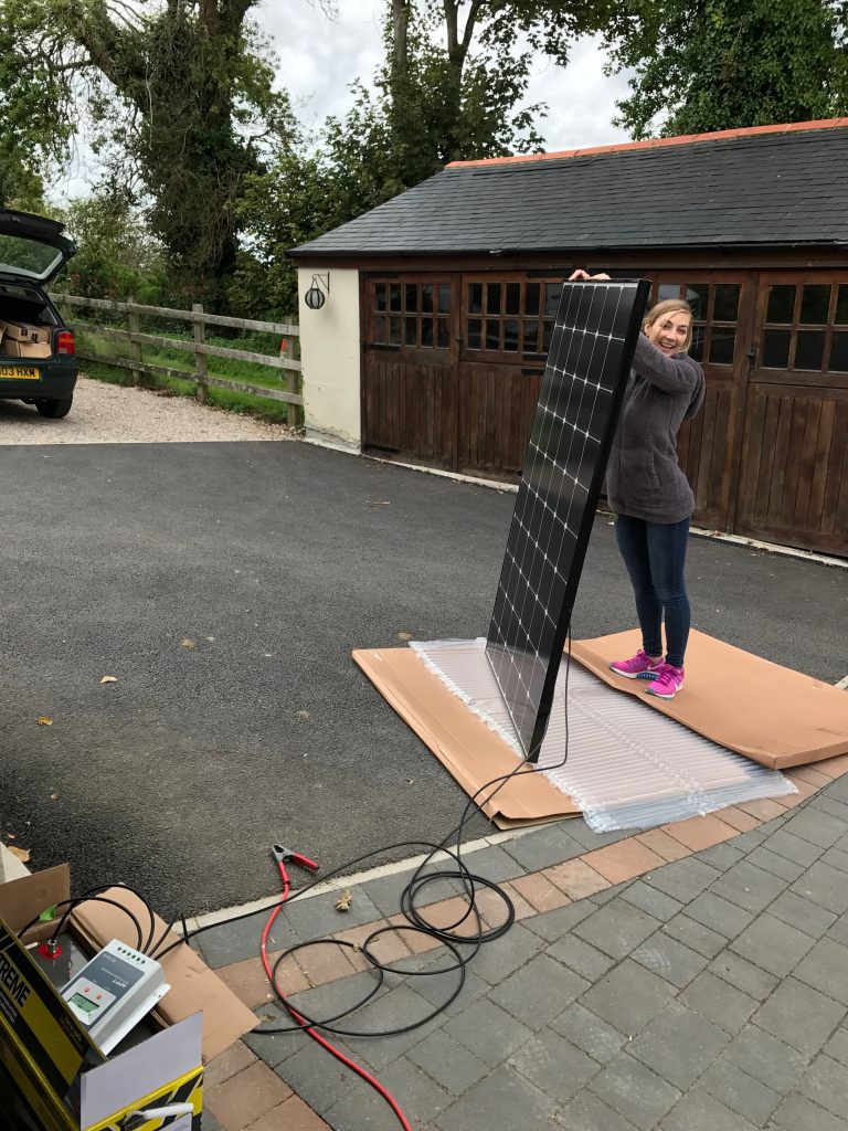 Holding up a solar panel to test it works